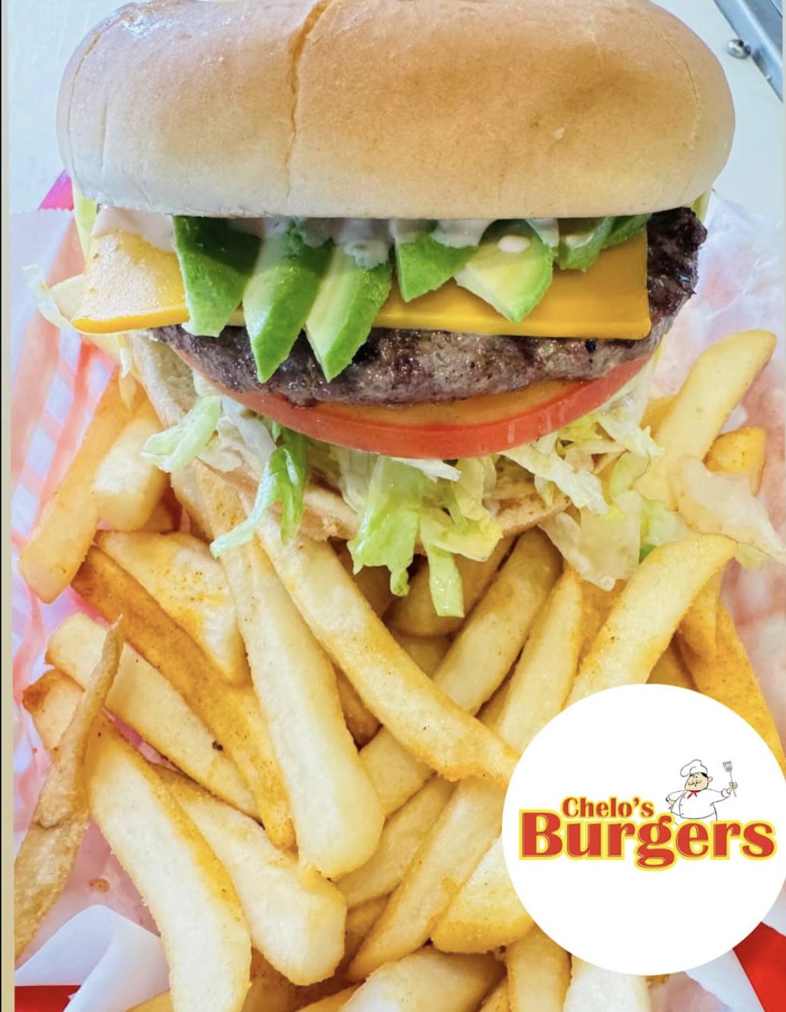 Avocado cheeseburger with fries